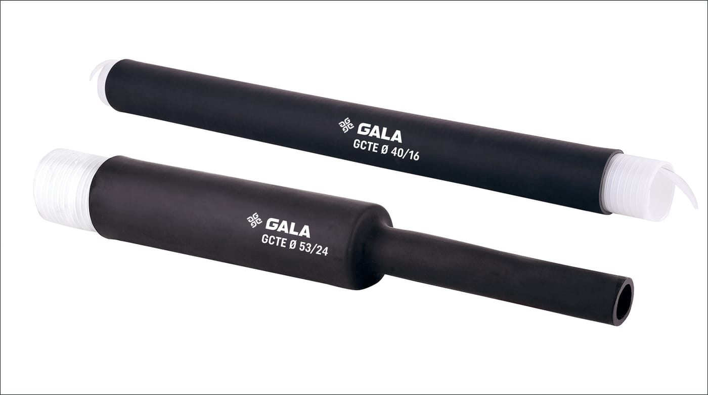 Two black rubber sleeves on a white ground, printed GALA GCTE Ø 40/16 and GALA GCTE Ø 53/24. Each is held open on a ribbed white spiral core with a pull tail out of one end; on the 53/24 the core has been drawn out of the right-hand half, which has closed down to a narrow tube with its bore visible at the cut.